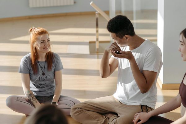 Diverse group of people in Poltava practicing yoga.